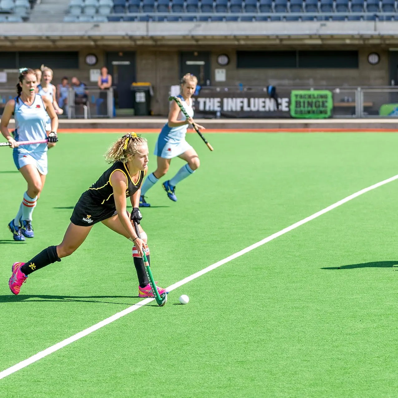 woman wearing black jersey playing on field